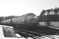 Platform scene at the north end of Newcastleton on a murky Saturday 28 December 1968 during the final days of through operations over the Waverley route. The train is the 0850 St Pancras - Edinburgh Waverley, hauled by Brush Type 4 no 1536.<br><br>[Bruce McCartney 28/12/1968]