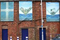 'Borders Railway Unwrapped' posters decorating the south face of the former Dean Oil Works building at Newtongrange. Photographed from the station car park on 19 March 2017 [see image 51991].<br><br>[John Furnevel 19/03/2017]