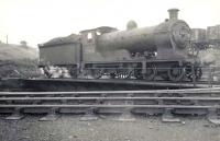 D33 4-4-0 62460 on the turntable at Eastfield in September 1949. The NBR veteran, built at Cowlairs in 1909, was less than two years from withdrawal.  <br><br>[G H Robin collection by courtesy of the Mitchell Library, Glasgow 03/09/1949]