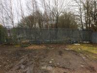 The trackbed at the start of the GBH&C in 2017, now part of the yard at the Network Rail Shettleston Depot. Behind the fence survives the 3 track bridge across Gartocher Road, which together with the bridges at Bothwell is one of the best preserved parts of the former railway's infrastucture. Access with permission.  <br><br>[Colin McDonald 17/03/2017]