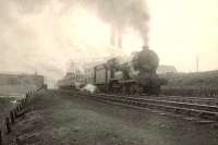 A Fife bound train being banked out of Queen Street, photographed climbing Cowlairs incline on 8 April 1952. Locomotive in charge is 'Director' 4-4-0 62697 <I>Lord James of Douglas</I>. <br><br>[G H Robin collection by courtesy of the Mitchell Library, Glasgow 08/04/1952]