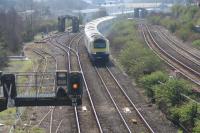 The 1129 Swansea to London Paddington shortly after leaving Swansea. The new Hitachi facilities at Mailphant Csd are visible above the rear power car. The lines to the right of the HST are the lines from Llanelli.<br><br>[Alastair McLellan /10/2015]