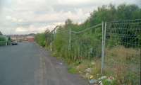 The view north up Bertram Street with the north end of Burnbank station on the right in 2000. Since the photograph was taken the trackbed has been redeveloped. [See image 6585] [Ref query 987]<br><br>[Ewan Crawford //2000]