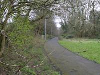 View south towards Bothwell station from the point where the trackbed has been preserved as a public footpath. Beyond the station site the path becomes the Bothwell Nature Trail. Behind the camera, a housing estate has been built on the site of Bothwell junction.<br><br>[Colin McDonald 15/02/2017]