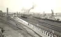 Looking east over Kelvinhaugh Junction on 28 May 1957 as V1 2-6-2T 67681 appears with a train bound for Singer.<br><br>[G H Robin collection by courtesy of the Mitchell Library, Glasgow 28/05/1957]