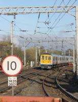 Cascaded and newly refurbished, but Northern vinyls not yet applied, 319450 slows to call at Wigan North Western with a Preston to Lime Street service on 6th April 2017.<br><br>[Mark Bartlett 06/04/2017]