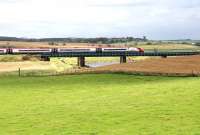 The 1200 Glasgow Central - London Euston runs over Float Viaduct shortly after passing Carstairs on 31 August 2016.<br><br>[John Furnevel 31/08/2016]