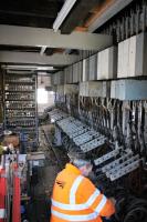 After a very cold night and then hot sun during the day a bit of routine adjustment is required in the locking room underneath Bury South signal box. This frame and all the associated interlocking and electrical equipment was entirely installed by the East Lancashire Railway signalling volunteers. Photo taken with kind permission during a supervised visit in March 2017.<br><br>[Mark Bartlett 25/03/2017]