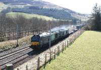 Approaching out of the sun on 27 March after crossing the Clyde at Lamington is the 0616 Daventry - Mossend Tesco containers. DRS 68002 <I>Intrepid</I> and 68023 <I>Achilles</I> accelerate the lengthy train north away from the viaduct.<br><br>[John Furnevel 27/03/2017]