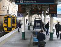 The 1103 service to Dunblane boarding at Waverley on 24 March at platform 9E. Alongside at platform 8E passengers are awaiting the arrival of the 0600 ex-Birmingham New Street CrossCountry service to Glasgow Central via Motherwell. This part of the station was transformed following the completion of major refurbishment work, including replacement of the old platform canopy, some three years ago. [See image 41379]<br><br>[John Furnevel 24/03/2017]