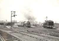 Scene at Glasgow's Buchanan Street station on 11 July 1955, with B1 4-6-0 61180 about to get underway with the 10.15am service to Inverness.<br><br>[G H Robin collection by courtesy of the Mitchell Library, Glasgow 11/07/1955]