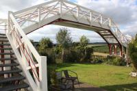 The footbridge at Hassendenean station seen on the 6th of October 2016. I have completely restored/repaired the footbridge now. Just a couple of main newel post finials and intermediate newels to have their caps replaced. And the 'Cross the line by the bridge' signs to add. Otherwise it’s looking great and have had plenty of compliments.<br><br>[Tom Pyemont 06/10/2016]