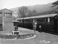 This is a BR Publicity photographs designed to be handed out and used for promotional purposes. The wording on the back says roughly PR&PO British Railways Please Acknowledge.<br>
<br>
This shows the TV train at Strathyre on 18th March 1962 with two passengers photographing the stork/heron or is the chap photographing the young lady photographing the stork? There's a third person lurking behind the fountain! In the The Frank Spaven photograph [see image 31991], it has already disappeared, presumably to its new home [see image 53168]?<br><br>[PR&PO British Railways (Douglas Blades Collection) 18/03/1962]