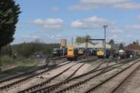 The shed yard, taken from a passing train. A Class 20, a 73, a 26 and in the far background a Peak.<br><br>[Peter Todd 02/04/2017]