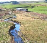 ScotRail 170474 runs alongside the upper reaches of the Gala Water just south of Heriot on 2 April 2017. The train is the 0845 (Sunday) Tweedbank - Edinburgh.<br><br>[John Furnevel 02/04/2017]