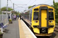 The 1305 to Edinburgh boards at Newcraighall during its last summer as a terminus. Apart from the livery of the trains, the updated Passenger Information Screen and the planter, not much has changed since the opening of the station 13 years before [see image 54452]. <br><br>[Colin McDonald 04/06/2015]