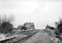 Scene at Sprouston looking east towards Tweedmouth in 1968. The station had lost its passenger service in 1955, with the line between Kelso and Tweedmouth closing completely ten years later. The old station building is now a much modified private residence [see image 10889]. [Ref query 996]<br><br>[Bruce McCartney //1968]