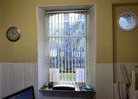 Inside looking out. View south across the platforms at Dinnet from the former station on 20 April 2017. Following closure of the line the building was fitted out for use as an office by the Dinnet & Kinord Estate. (Note the circular window, once occupied by the platform - facing station clock) [see image 22909]. The trackbed here now forms part of the Deeside Way. [Ref query 1001]  <br><br>[Andy Furnevel 20/04/2017]