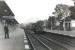 Standard class 4 2-6-4T 80000 photographed at Corkerhill station on 30 June 1959 with a St Enoch - Largs train. 'Corkerhill railway village' and signal box can be seen in the background. [See image 19972] <br><br>[G H Robin collection by courtesy of the Mitchell Library, Glasgow 30/06/1959]
