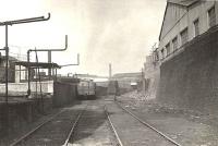 The former route to Windmillcroft Quay was cut back to West Street a few years<br>
after the opening of General Terminus. This view looks north not far<br>
from the buffers in March 1956. [See image 57936] <br><br>[G H Robin collection by courtesy of the Mitchell Library, Glasgow 29/03/1956]