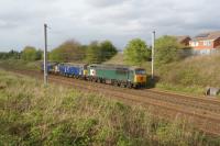 DCR Class 56 no.56303 heads south with former DRS 47813 and 37601 at Farington south of Preston on a Carlisle to Leicester move on 11 April 2017.<br><br>[John McIntyre 11/04/2017]