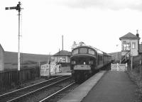 Holbeck 'Peak' D11 runs through the staggered platforms of Heriot station on Saturday 16 July 1966 with the up <I>Waverley</I>.<br><br>[Dougie Squance (Courtesy Bruce McCartney) 16/07/1966]