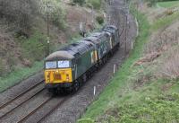 After working northwards light engine DCR liveried 56303 returned from Carlisle with Brush Type 4 47813 and EE Type 3 37601 on 11th April 2017. Both of these have been sold by DRS recently. DRS branding had been removed from both locos and they were being hauled to Leicester depot, seen here at Forton near Garstang.<br><br>[Mark Bartlett 11/04/2017]