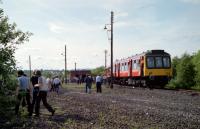 The Tayforth Venturer Tour was operated by DMU 107 444. It is seen here at Oakley Yard, exchange yard for Comrie Colliery, on the 16th of June 1984. The colliery officially closed in 1986. The track bed seen running to the left is the former line to Stirling.<br><br>[Douglas McPherson 16/06/1984]