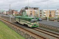 <I>Centenary</I> car 648 passes the old Miners' Convalescent Home at Bispham on 170417. For a long time these stylish single deckers ran with modified bodywork [See image 37088] but 648 has been restored to its original condition and looks much better for it. This elevated vantage point is often blocked off for the illuminations tableaux but is open at this time of year. <br><br>[Mark Bartlett 17/04/2017]