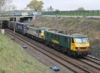 Nearly forty of the fifty Class 90s built are still working in 2017, with the remainder stored for various reasons. Freightliner have ten operational locos including 90046 and 90048, seen here passing Hampson Lane bridge between Galgate and Bay Horse with a Coatbridge to Daventry container train on 20th April 2017. [See image 54821] <br><br>[Mark Bartlett 20/04/2017]