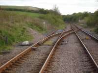 After leaving the two platform Hunmanby Station and running over the level crossing at the platform end, trains heading for Bridlington cross over via twin points onto the northbound track, which then continues as a single track to the resort. As can be seen in this April '17 view there is a substantial length of track, albeit partly overgrown, remaining in situ beyond the southbound line points that form part of the crossover. Is this retained as an engineers siding?<br><br>[David Pesterfield 17/04/2017]