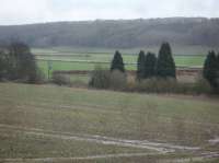 A lengthy section of the trackbed running east from Gilling Station towards Cawton, where the parallel single lines to Malton & Pickering diverged, is normally used each year for the over winter storage of long rows of round straw bales, as seen in this early 2017 view looking in a south easterly direction. <br><br>[David Pesterfield 30/01/2017]