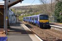 Ex London Midland unit now 320413 and in ScotRail livery arrives at Kilpatrick with an eastbound service on 27 April 2017.<br><br>[John McIntyre 27/04/2017]