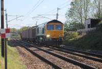 A MOD freight ran from Bicester to Carlisle on 5th May 2017. GBRf 66709 <I>Sorrento</I> was the loco in charge of four bogie container wagons with barrier vans front and rear. The unusual working is seen approaching Woodacre near Garstang.  <br><br>[Mark Bartlett 05/05/2017]