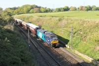 88002 <I>Prometheus</I> was entrusted with the first Class 88 passenger train on 9th May 2017, a special from Euston to Carlisle using <I>Northern Belle</I> stock. The train is seen on the return run passing through the cutting at Forton at 100mph. 68022 <I>Resolution</I> was out of sight on the rear of the train. <br><br>[Mark Bartlett 09/05/2017]