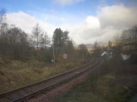 View from a non-too-clean Sprinter window of the Crianlarich chord diverging from the main West Highland line just north of Crianlarich station. <br><br>[Colin McDonald 12/04/2017]
