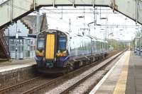 380015 departs from Bishopton heading to Glasgow on 27 April 2017.<br><br>[John McIntyre 27/04/2017]