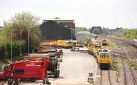 View west showing a selection of the various plant and equipment located at Highworth Junction GW electrification depot to the east of Swindon on 5 May 2017. The Great Western main line runs past on the right.<br><br>[Peter Todd 05/05/2017]