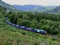 68005 'Defiant' climbs towards Kingswood tunnel with Inverness - Mossend empty containers on 29th July 2014.  Earlier on the same date this loco had made the Class 68 debut on the Highland main line. David Spaven comments: the large majority of containers on the Inverness-Mossend service are actually loaded - typically with board products from the Norbord plant at Dalcross. Back-loading is critical for the rail economics, as indeed it is for road hauliers.<br><br>[Graeme Blair 29/07/2014]