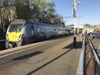 A 6-coach Class 334 on an Edinburgh – Helensburgh service passes through Shettleston station at speed on a sunny May evening.<br><br>[Colin McDonald 08/05/2017]