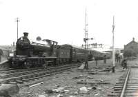 Preserved North British 4-4-0 256 <i>Glen Douglas</i> pauses at Uddingston East with the SLS <i>'Glasgow City & District Tour'</i> on 30 April 1960.<br><br>[G H Robin collection by courtesy of the Mitchell Library, Glasgow 30/04/1960]