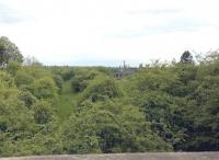 Looking south west towards Rugby from near Clifton Mill station on the LNWR line from Peterborough in April 2017. The disused viaduct once carried the line over Butlers Leap on the approach to Rugby station. [Ref query 1015]<br><br>[Ken Strachan 27/04/2017]