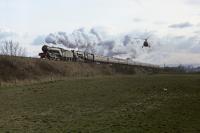 4771 'Green Arrow' + 92220 'Evening Star' are buzzed at Kinbuck with the EMI Music Express.  7th April 1986.<br><br>[Graeme Blair 07/04/1986]