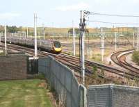 A fine and sunny morning at Carstairs on 11 May 2017 sees the 1040 Glasgow Central - London Euston Pendolino about to run through Carstairs South Junction, with the Edinburgh line curving away to the north.<br><br>[John Furnevel 11/05/2017]