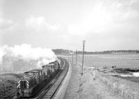 Approaching Kelso Junction from the south on 11 April 1967. Black 5 44767 is heading for Edinburgh hauling Hunslet class 05 DM shunters D2608, D2617 and D2593. The consignment was on its way from 56G Bradford Hammerton Street to 64B Haymarket. [See image 45108]<br><br>[Bruce McCartney 11/04/1967]