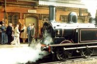 LNWR <I>Coal Tank</I> 1054 (58926) at Shrewsbury on 18th October 1986, having just pulled in to take over the  <I>Cam Camwell 80th Birthday Special</I> for a run via Gobowen and Chester to Stockport. Cam himself, suitably surprised by the motive power for his train, can be seen on the platform in front of the locomotive (along with another future Railscot contributor). [See image 25362]<br><br>[Malcolm Chattwood 18/10/1986]