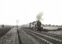 A southbound train takes the Kilmarnock route at Dalry Junction on 27 July 1955. The locomotive is Hurlford based 2P 4-4-0 no 40688.<br><br>[G H Robin collection by courtesy of the Mitchell Library, Glasgow 27/07/1955]