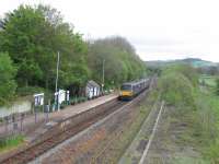 The 12.27 Exeter St Davids to Barnstaple service draws into Yeoford request<br>
stop on 22 April 2017. The station waiting shelter incorporates a free,<br>
community-organised lending library (well, actually a couple of shelves of<br>
books). The rusting rails of the bi-directional Dartmoor line in the<br>
foreground disguise the fact that it is still operational, despite the loss<br>
of aggregates traffic from Meldon Quarry (now closed), which formerly<br>
generated up to seven trains a day. A passenger charter operated from<br>
Paddington to Okehampton in February 2017 and the summer-only service from<br>
Exeter to Okehampton, supported by the County Council,  is due to resume<br>
operation in May.<br><br>[David Spaven 22/04/2017]