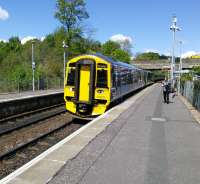 158 724 calls at Bridge of Allan with a Dunblane to Edinburgh service on 18th May 2017. An opposite working heads north, passing the site of the original station on the other side of the old A9 road bridge. [See image 39457]<br>
<br><br>[David Panton 18/05/2017]