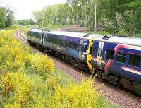 The 0945 Tweedbank - Edinburgh runs through Gore Glen Country Park on 21 May 2017, midway between its scheduled stops at Gorebridge and Newtongrange.<br><br>[John Furnevel 21/05/2017]